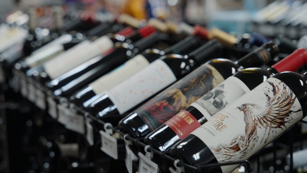 Wine bottles lined up in racks