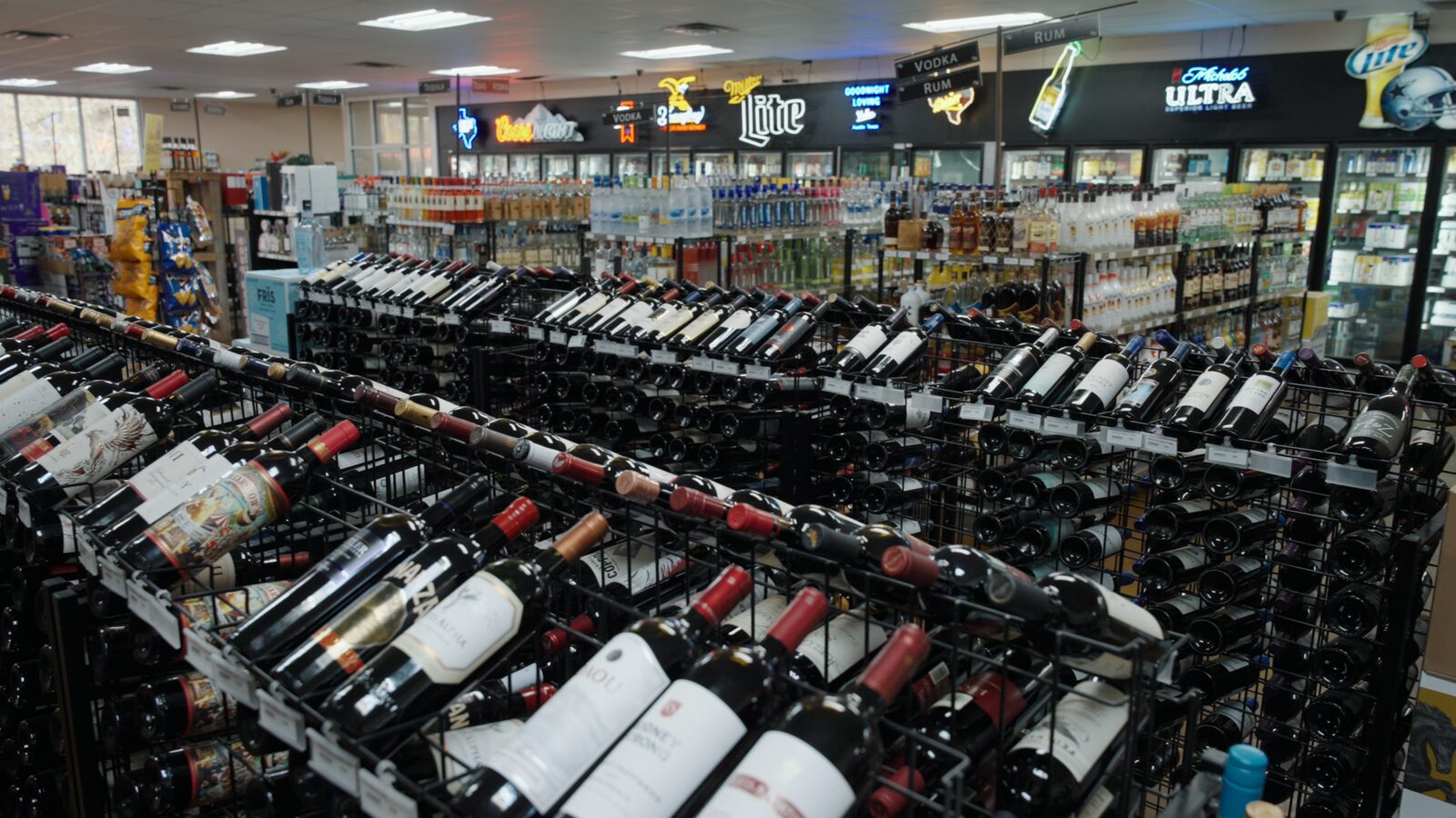 Inside Crystal Springs Spirits, rows of wine and spirits